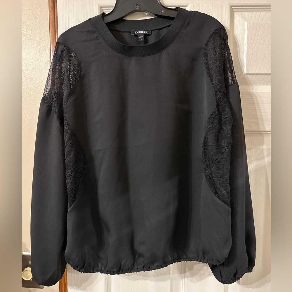 Cute black women’s top from Express size medium with lace cutout details